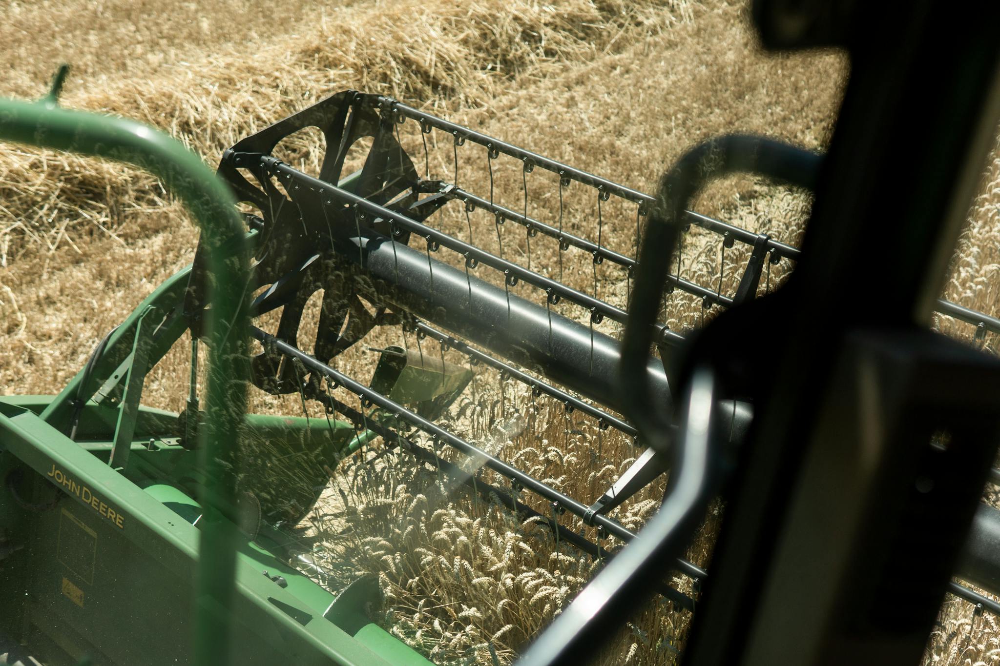 View from inside combine harvester harvesting wheat in Gescher, Germany.